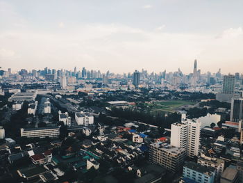 High angle view of city buildings against sky