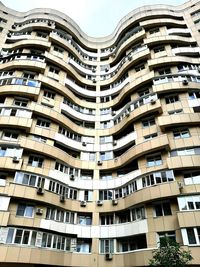 Low angle view of apartment buildings against sky