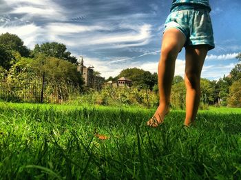 Woman standing on grass