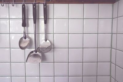 Close-up of electric lamps hanging on floor at home