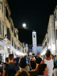 Crowd in city at night