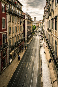 High angle view of tramway amidst buildings on street in city