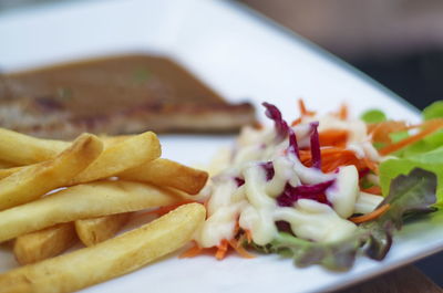 Close-up of meat and vegetables on plate