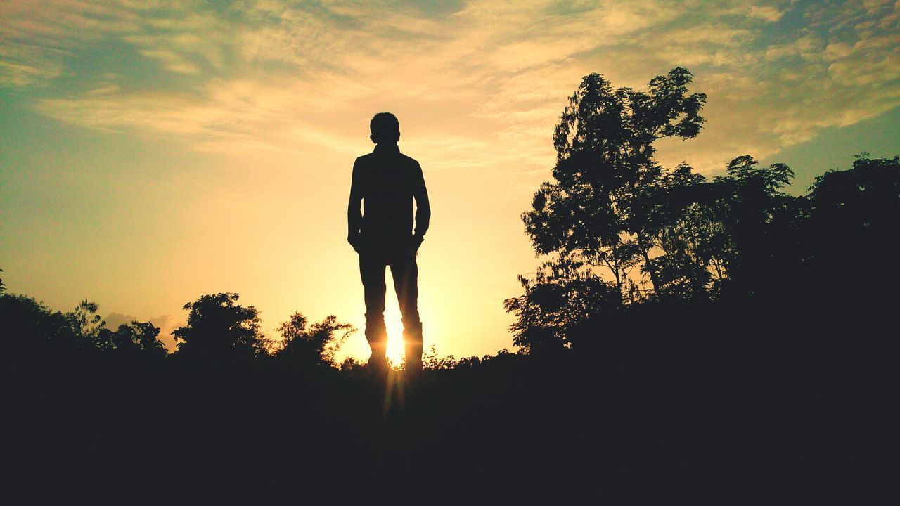 silhouette, sunset, sky, standing, men, lifestyles, leisure activity, orange color, tranquility, tree, nature, tranquil scene, beauty in nature, cloud - sky, full length, scenics, rear view, outdoors