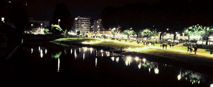 Reflection of illuminated buildings in water