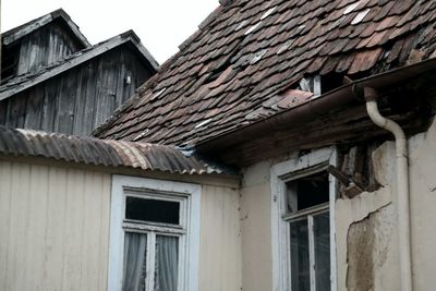Low angle view of old abandoned house