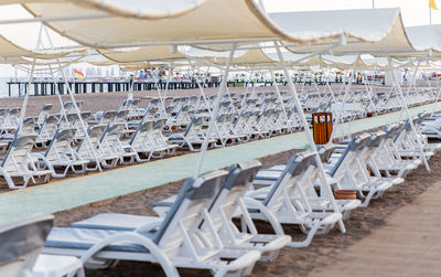 Lounge chairs and tables at beach