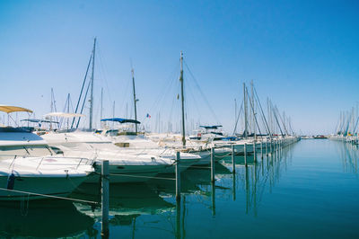 Boats moored at harbor