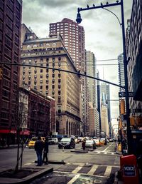 City street against cloudy sky