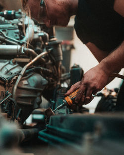 People working at a car chassis