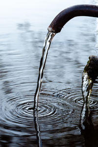 Close-up of water drop on lake