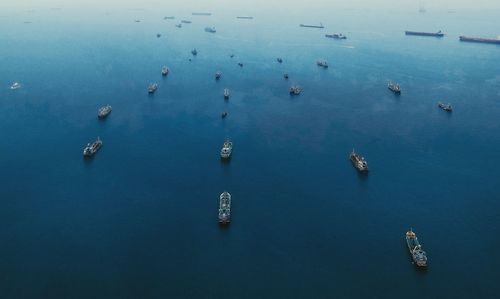 High angle view of sailboats moored in sea