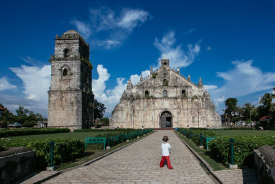 Low angle view of historic building against blue sky