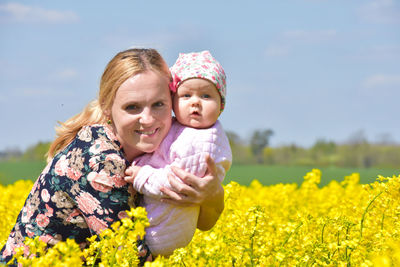 Portrait of smiling women on field