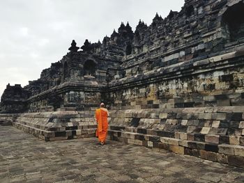 Rear view of old temple against building