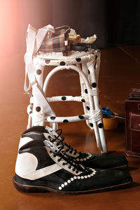 Close-up of shoes on table