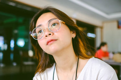 Close-up portrait of smiling young woman