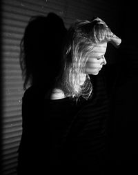 Rear view of women standing at home