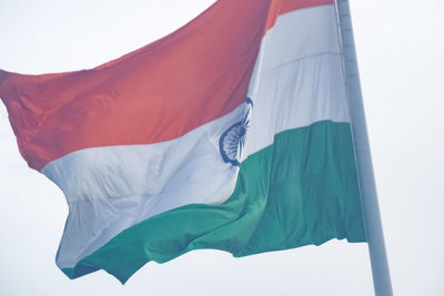 India flag flying high at connaught place with pride in blue sky, india flag fluttering, indian flag