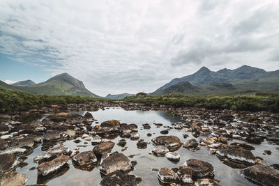 Panoramic view of lake and mountains against sky