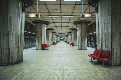 Empty corridor in illuminated building