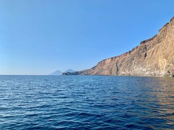 Scenic view of sea against clear blue sky