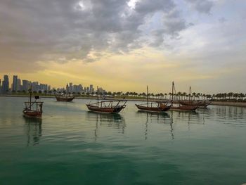 Scenic view of sea against sky in city