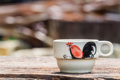 Close-up of coffee cup on table