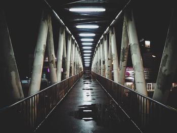 Empty corridor in illuminated building