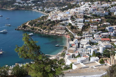 High angle view of townscape by sea