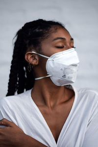 Young black woman in face mask