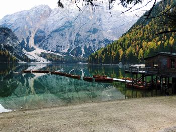 Scenic view of lake by snowcapped mountains