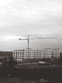 City street by buildings against sky