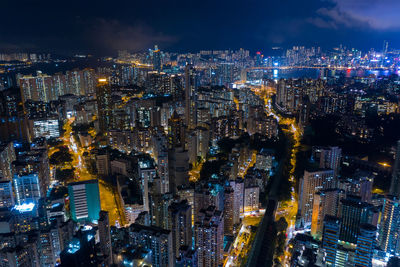 Aerial view of illuminated buildings in city at night