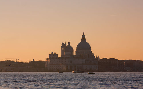 Grand canal against santa maria della salute during sunset