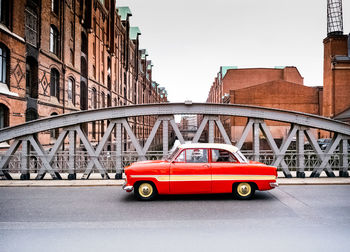 Red car on bridge