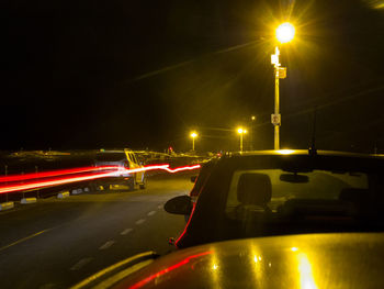 Traffic light trails on road at night