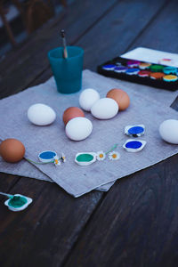 High angle view of multi colored eggs on table