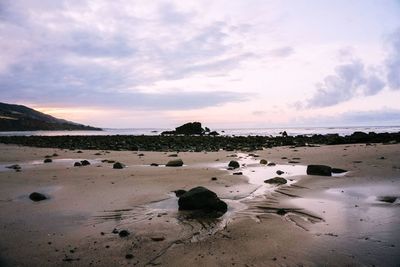 Scenic view of sea against cloudy sky