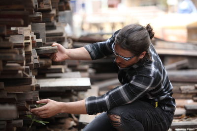 Side view of woman working