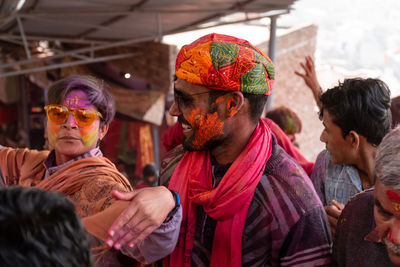 Portrait of people with multi colored umbrellas