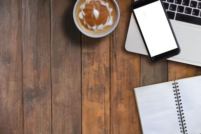 High angle view of coffee cup on table