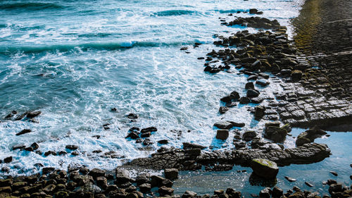 High angle view of rocks on beach