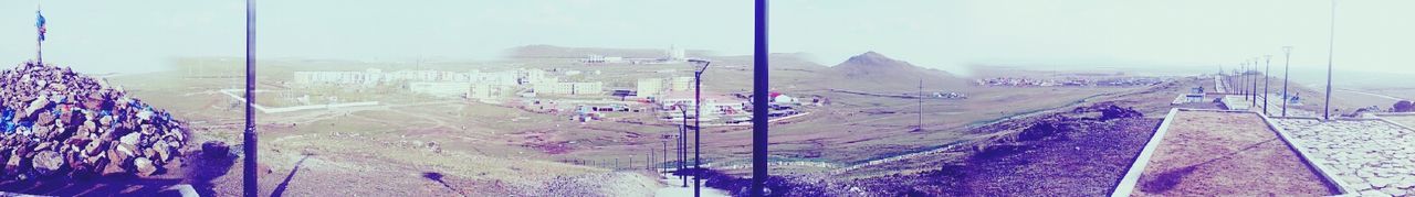 beach, multi colored, panoramic, sky, day, sand, sea, water, outdoors, flag, transportation, tranquility, nature, mountain, graffiti, sunlight, clear sky, blue, no people, tranquil scene