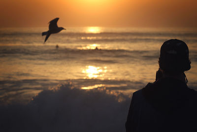 Scenic view of sea at sunset