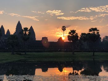 Scenic view of lake against orange sky