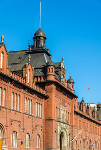 Low angle view of building against blue sky