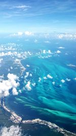 High angle view of sea against blue sky