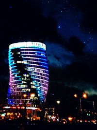 Low angle view of illuminated lights in the dark