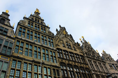 Low angle view of buildings against sky in brussels